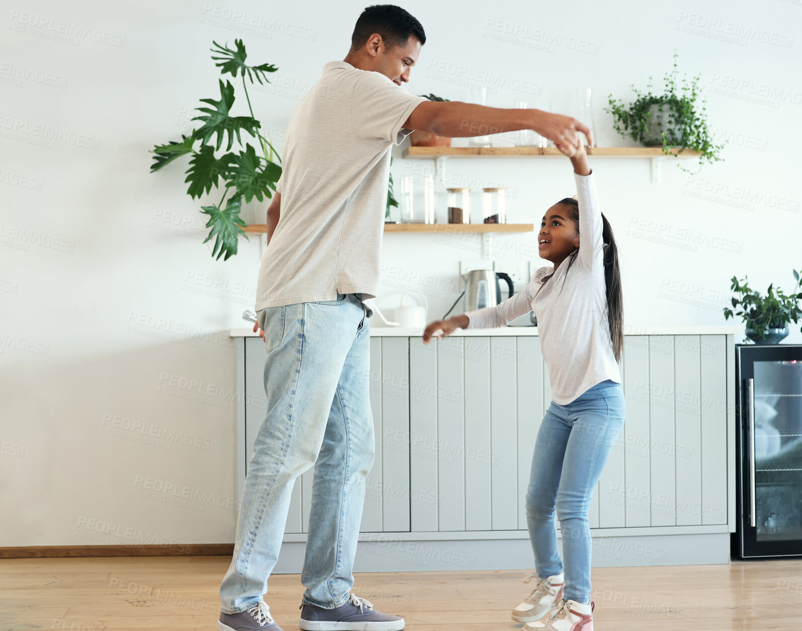 Buy stock photo Dance, playful and father and daughter bonding, teaching a move and enjoying quality time. Love, help and dad dancing with a girl daughter, playing and being crazy with happiness in the kitchen