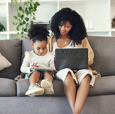 Buy stock photo Laptop, tablet and black family online for learning, remote work or education in home living room. Woman or mother and girl child together on couch with internet for games or to watch movie and relax