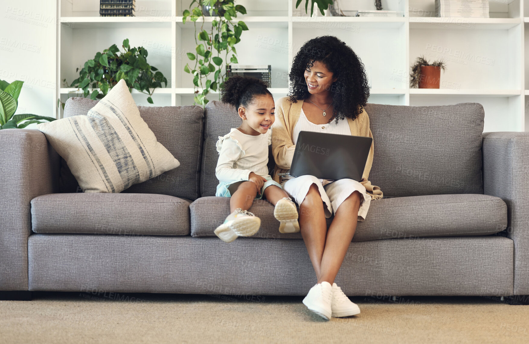 Buy stock photo Family, mother and child with laptop in home living room for remote work, online education and wifi. Black woman and girl together on couch with internet for learning, games and watch movies to relax
