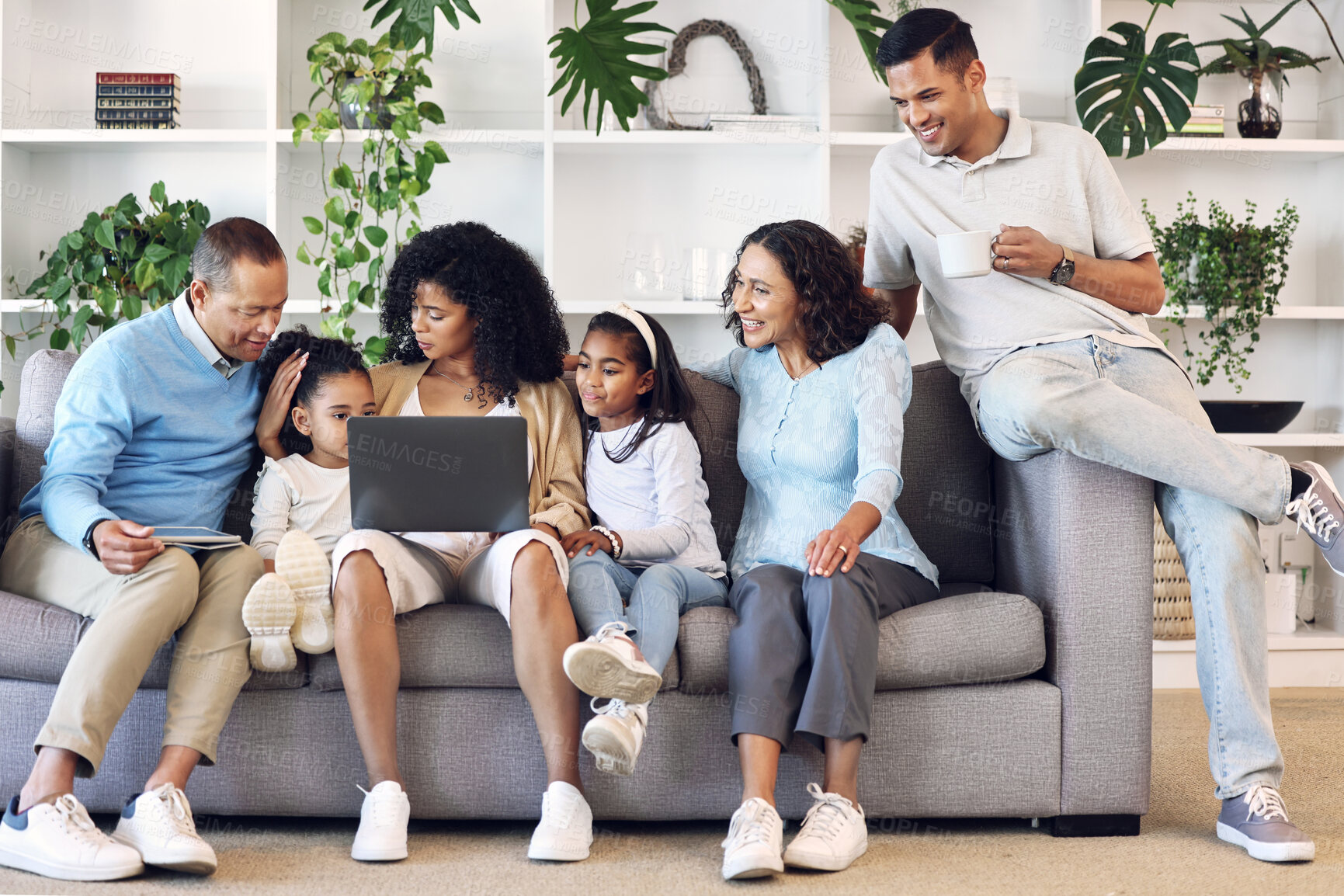 Buy stock photo Big family, home and laptop on couch learning with online education, games or movie. Parents, grandparents and children relax together in lounge with internet for quality time streaming and bonding