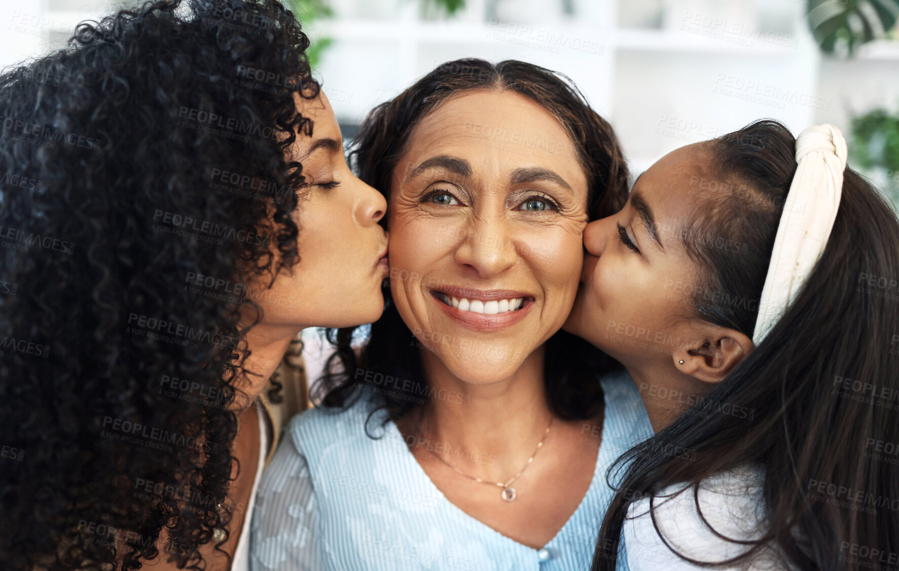 Buy stock photo Portrait, kiss on the cheek for a senior woman with her daughter and granddaughter in their home together. Face, love or family with a mother, adult child and girl bonding in a house on mothers day
