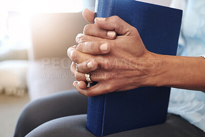 Buy stock photo Book, prayer and hands of old woman in living room for religion, bible and Christian faith. Spiritual, God and worship with senior lady praying with holy text at home for wellness, believe and goal 