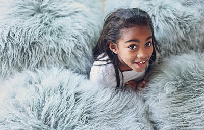 Buy stock photo Relax, happy and portrait of a child with pillows in her modern bedroom in her home. Happiness, smile and girl kid resting, having fun and being playful with fluffy blankets in her room at a house.