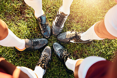 Buy stock photo Shoes, huddle and team on grass field above for sports motivation, coordination or collaboration outdoors. Feet and legs of group in sport circle, fitness training or planning strategy ready for game