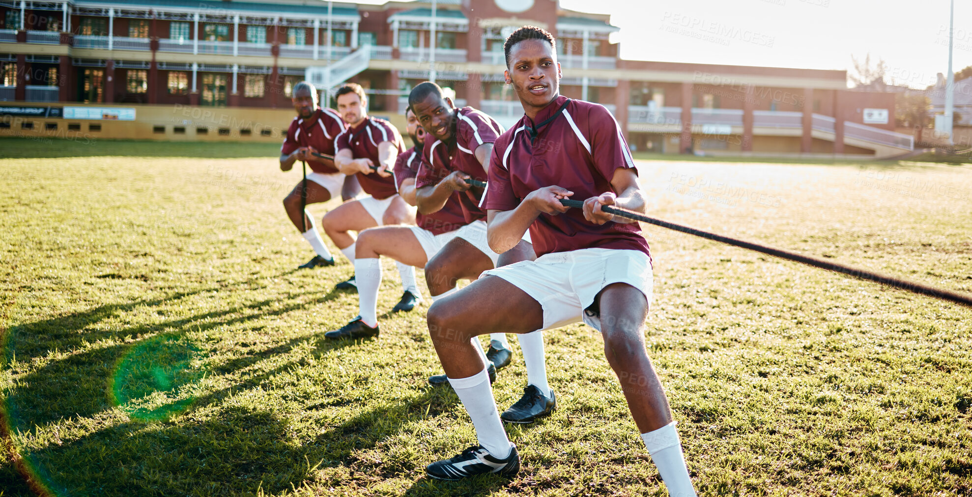 Buy stock photo Man, team and sports tug of war with rope for fitness exercise, strength challenge or competition on field. Sport men in rivalry, teamwork struggle or leadership pulling ropes in training activity