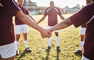 Buy stock photo Man, team and holding hands for sports huddle, collaboration or coordination on grass field. Group of men touching hand in circle for teamwork, community or sport solidarity for outdoor game or match