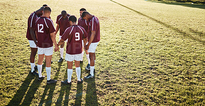 Buy stock photo Men, huddle and team holding hands praying on grass field for sports coordination or collaboration outdoors. Group of sport players in fitness training, planning or getting ready for game on mockup