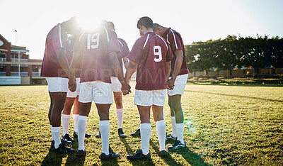 Buy stock photo Rugby, field or team in a circle praying for motivation, solidarity or support after sports training. Young men, fitness or group of male athletes in unity before a game or match on a grass stadium