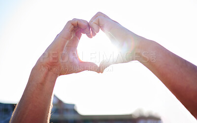 Buy stock photo Love, heart and hands with sunshine, support and collaboration with light, mockup and outdoor. Closeup, zoom and sign with lens flare, community and peace with wellness, care and kindness outside