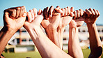 Fist hands, sport community and hand closeup of exercise team together on a outdoor field. Sports support, workout and fitness friends ready for a athlete competition with blurred background