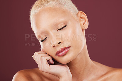 Buy stock photo Makeup, beauty and hands of woman on face in studio for wellness, grooming or natural, maroon or red background. Skincare, luxury and girl model relax in hygiene, skin and cosmetic treatment isolated