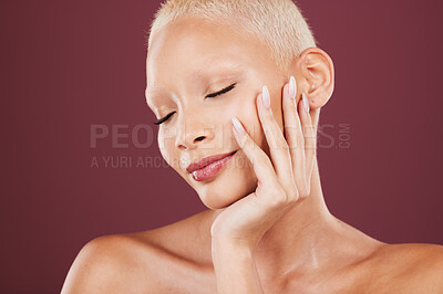 Buy stock photo Makeup, black woman and hands on face in studio, soft and beauty cosmetics, natural and maroon or red background. Skincare, glow and girl model relax in luxury pamper treatment and isolated on mockup