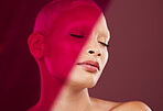 Makeup, cosmetics and woman with a red light for creativity isolated on a purple background in studio. Wellness, peace and model with clear skin, clean complexion and beauty glow on a backdrop