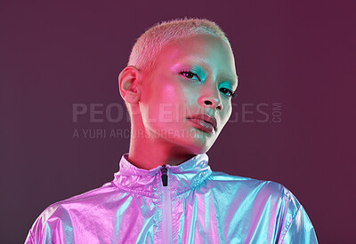 Buy stock photo Futuristic fashion, cyberpunk portrait and black woman with chrome clothing in studio. Vaporwave, isolated and gen z with a young female model glow with cosmetics and scifi clothes with mockup