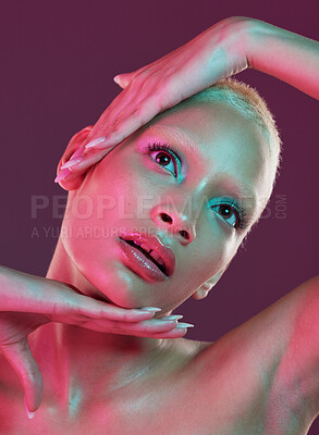 Buy stock photo Creative, beauty and art, woman with neon makeup and lights for skincare advertising on studio background. Cyberpunk face, fantasy and model isolated for skin care and futuristic mock up space.
