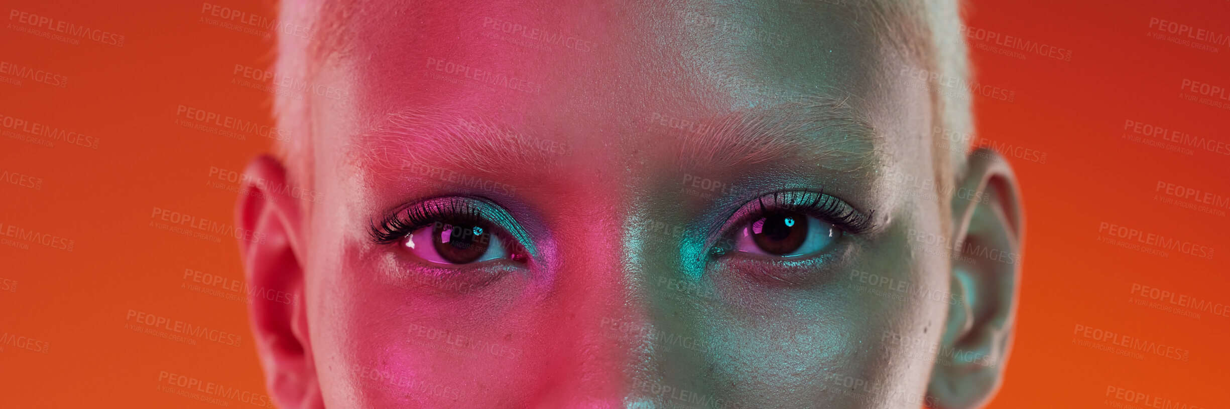 Buy stock photo Makeup, cyberpunk and portrait of the eyes of a woman isolated on an orange background in a studio. Edgy, creative and banner of the face of a trendy model with cosmetics, glamour and eyeshadow