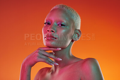 Buy stock photo Cyberpunk, neon beauty and portrait of woman with makeup and light in creative advertising on orange background. Art, product placement and model isolated for skincare and futuristic mockup in studio