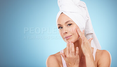 Buy stock photo Towel, portrait and woman touch face in studio for beauty, dermatology or mockup blue background. Female model, skincare shower and facial aesthetic for healthy shine, glow transformation or cleaning