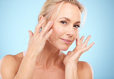 Buy stock photo Woman, portrait and facial beauty to touch skincare, mockup and blue background for wellness cosmetics. Studio model, face and healthy aesthetic of laser dermatology, natural shine and salon results