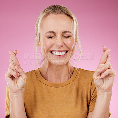 Buy stock photo Woman, fingers crossed and hope in studio, pink background and smile face. Female model wish for luck with hands of bonus, promotion and winning giveaway for emoji sign, competition prize and lottery