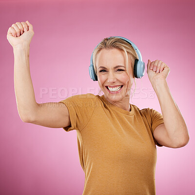 Buy stock photo Music, dance and portrait with a woman in studio on a pink background for crazy fun or cheerful positivity. Party, energy and radio with a person streaming audio while dancing on a pastel color wall