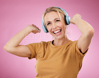Buy stock photo Music, dance and freedom with a woman in studio on a pink background for crazy fun or cheerful positivity. Party, energy and radio with a person streaming audio while dancing on a pastel color wall