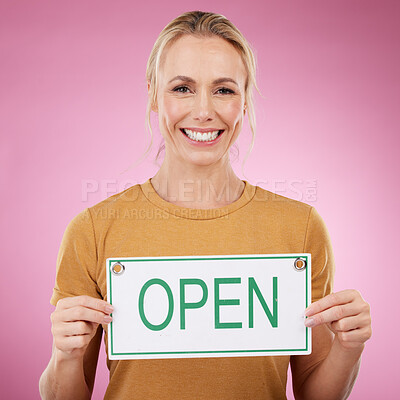 Buy stock photo Woman, open sign and portrait in studio, announcement or welcome on pink background. Happy female model advertising opening poster, signage and marketing information of excited news, service or smile