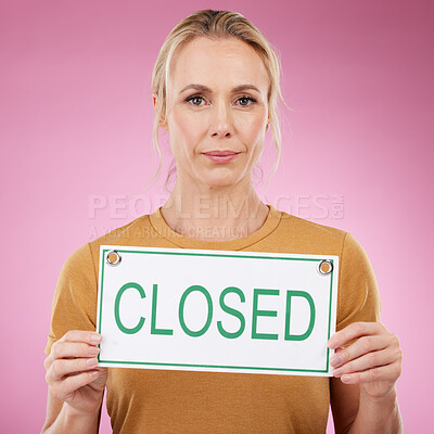 Buy stock photo Closed sign, portrait and woman with a small business in a studio with a board for announcement. Professional, entrepreneur and female employee with poster for her company or work by pink background.