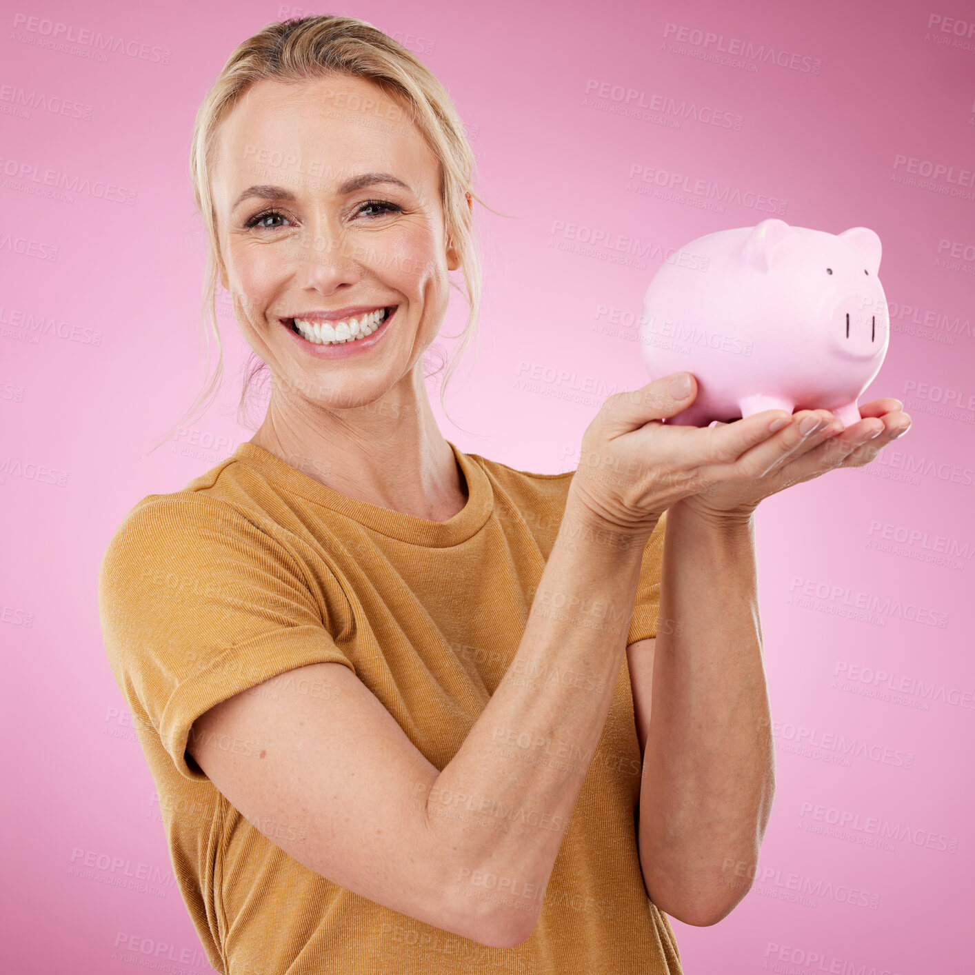 Buy stock photo Woman, piggy bank and portrait for savings on pink background, studio and backdrop. Happy female holding financial tin for loan, profit or finance investment with cash, money and accounting budget