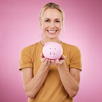 Woman, piggybank and portrait smile for savings, investment or cash money against a pink studio background. Happy female holding financial loan, profit or finance increase and salary on mockup