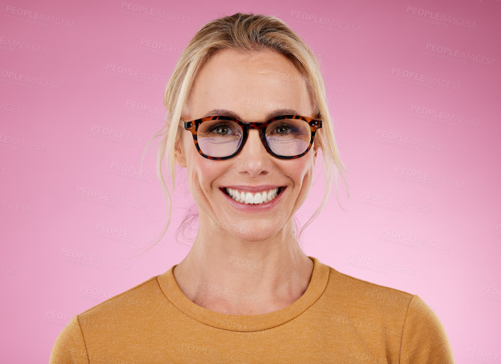 Buy stock photo Woman, glasses and portrait to smile on pink background, studio backdrop and happiness. Happy female model, face and spectacles for fashion, eye care and vision of frames, cosmetic beauty and lenses
