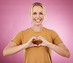 Heart, hands and portrait of woman on pink background, studio and color backdrop with emoji, care and kindness. Happy female model with finger shape for love, thank you and smile in support of peace
