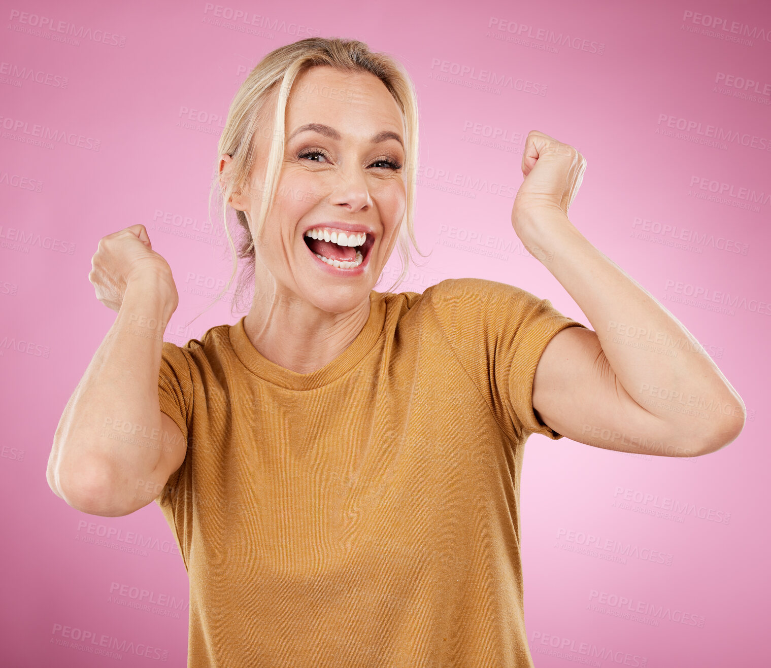 Buy stock photo Excited, winner and winning mature woman cheering for a prize isolated against a pink studio background happy and smile. Portrait, celebration and older female celebrate win feeling cheerful