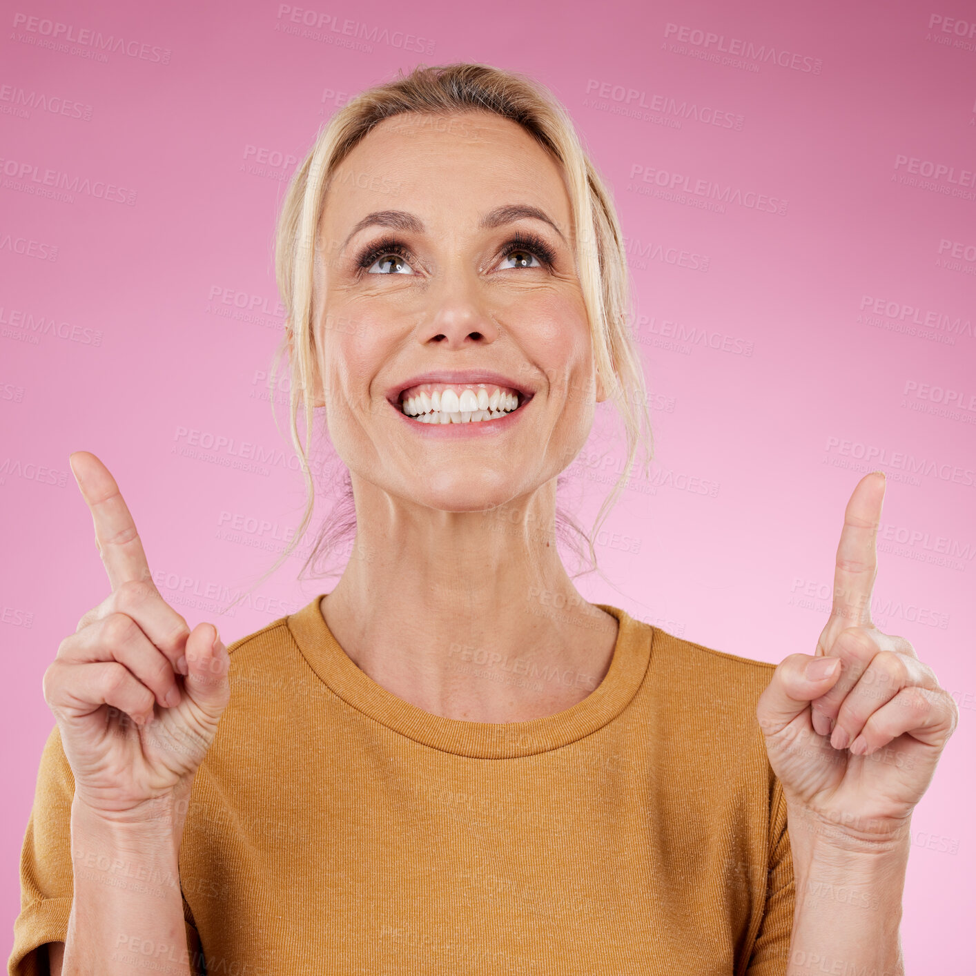 Buy stock photo Mockup, woman and pointing on pink background, studio offer and advertising space. Happy female model, marketing and product placement of promotion, announcement and commercial mockup, news or review