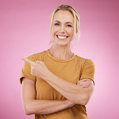 Buy stock photo Pointing, portrait and woman on pink background, mockup studio offer and advertising color space. Happy female model, marketing and promotion of product placement, announcement and commercial mock up