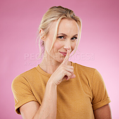 Buy stock photo Secret, portrait and woman with lips on finger in studio, pink background and privacy. Female model with silence gesture on mouth for quiet, shush hands and gossip for whisper, silent emoji and smile