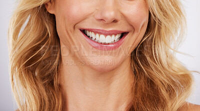 Buy stock photo Closeup, smile and woman mouth in studio for dental, hygiene or teeth whitening on grey background. Oral, zoom and cleaning for lady satisfied with bleaching, braces or porcelain veneers results