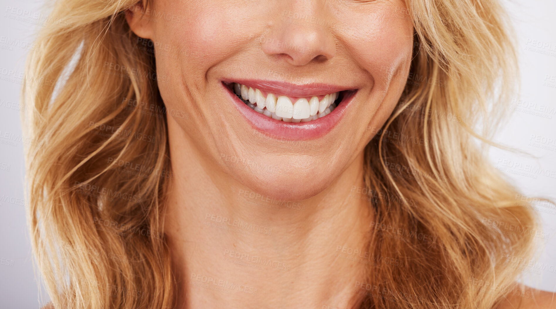 Buy stock photo Closeup, smile and woman mouth in studio for dental, hygiene or teeth whitening on grey background. Oral, zoom and cleaning for lady satisfied with bleaching, braces or porcelain veneers results