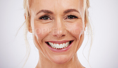 Buy stock photo Teeth whitening, portrait and smile of woman in studio, beauty background and fresh mint breath. Happy female model, face and skincare for dental wellness, tooth implant and aesthetic facial salon 