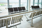 Background of empty airport, terminal lounge and chair furniture in waiting room. Airplane lobby, seat and space of commercial flight, clean building interior and global travel design for journey 