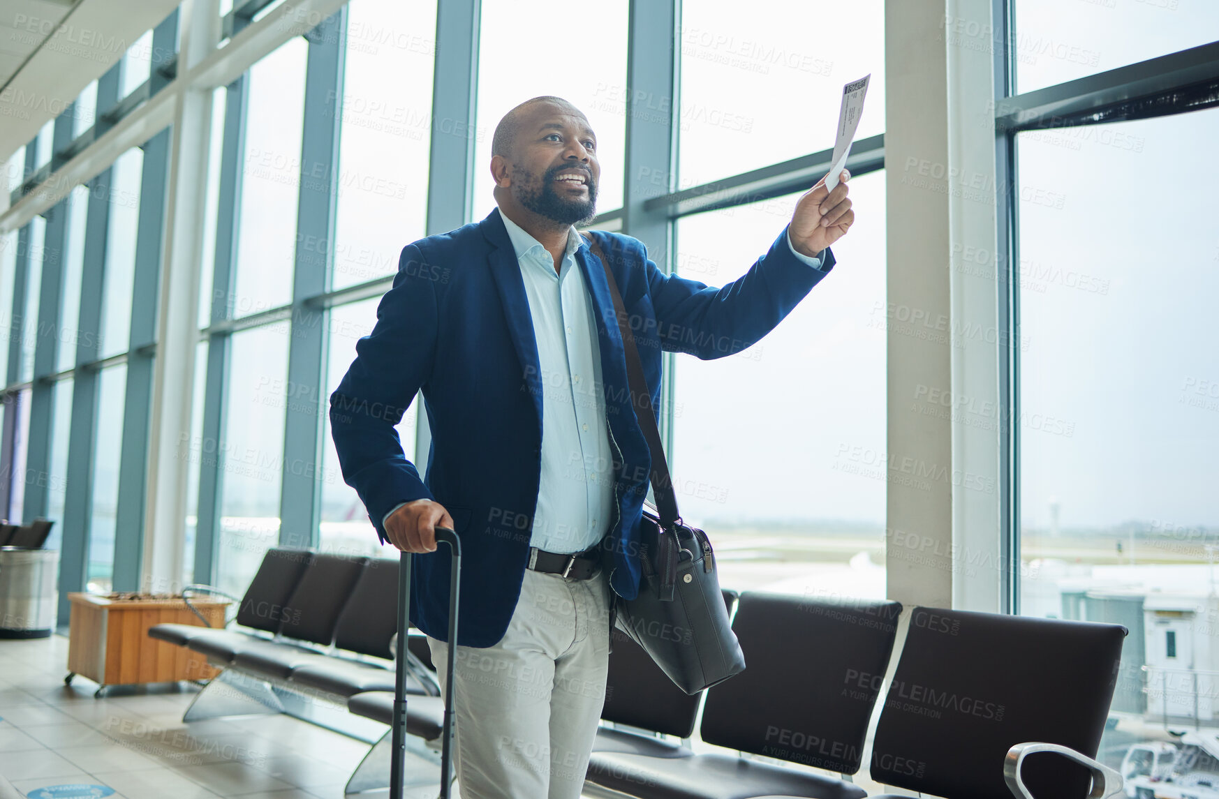Buy stock photo Black man, ticket and airport walking to departure for travel, business trip or journey by windows. Happy African American male with smile holding document or boarding pass ready for airplane flight