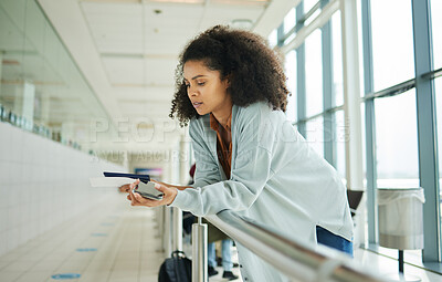 Buy stock photo Ticket, airport and passport of black woman for travel, global opportunity and transport time or schedule. UK person with smartphone and identity document in lobby for flight services and immigration