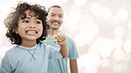 Dental, learning and brushing teeth with child and father with bokeh mockup for oral hygiene, self care and toothbrush. Smile, happy and wellness with man and son in bathroom for teaching and health