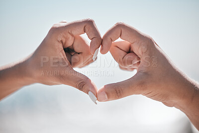 Buy stock photo Hand, heart and couple with love, peace and unity sign on mockup, space or blurred background. Hands, emoji and care finger shape by man and woman bonding on travel, vacation or summer trip in nature