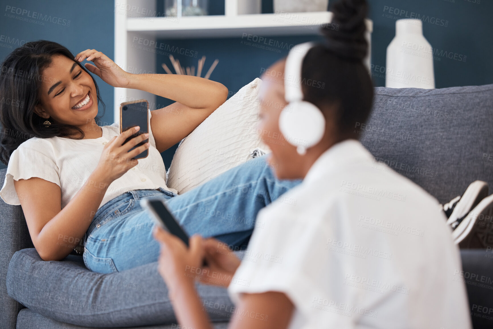Buy stock photo Happy, relax and friends relax in living room, bond and enjoy streaming service in their apartment. Day off, chilling and women having fun indoors in their home, reading meme, social media or app
