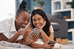 Woman, friends and phone with smile for social media, online post or vlog lying on floor in living room at home. Happy women relaxing and smiling on smartphone for communication, wifi or networking