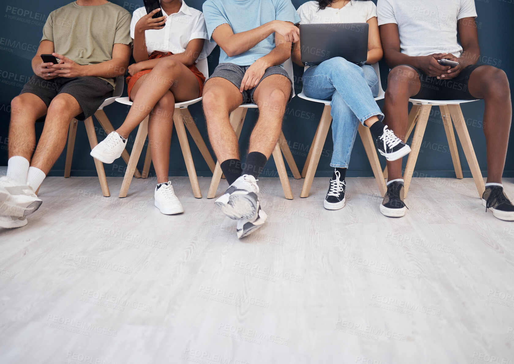Buy stock photo People, legs and sitting in waiting room networking for interview, social media or marketing team. Leg of group in wait with technology for network, hiring or recruitment on chairs in row on mockup