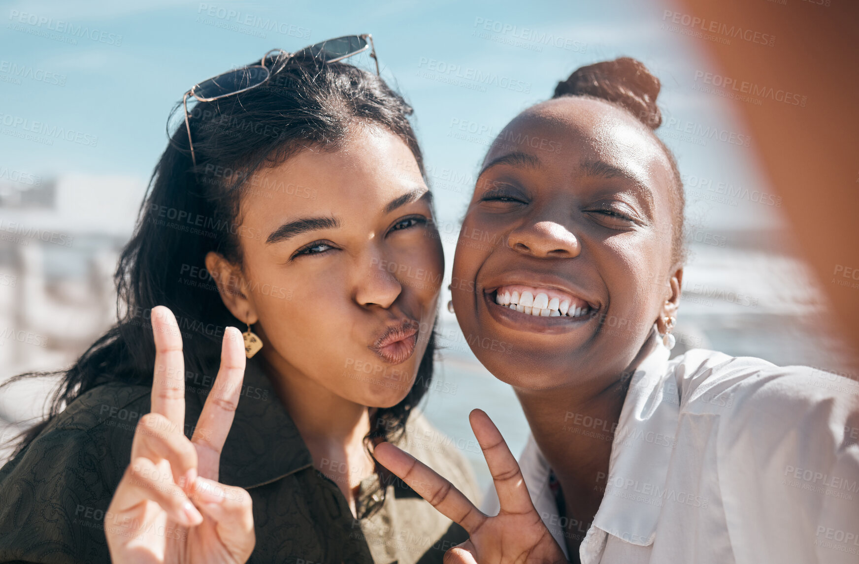 Buy stock photo Woman, friends and smile with peace sign for selfie, profile picture or vlog at the beach for summer vacation. Portrait of happy women smiling for photo memory, friendship or joy by the ocean coast