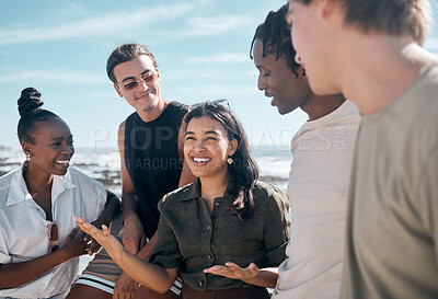 Buy stock photo Woman, talking and bonding people by beach, ocean or sea in group social gathering, holiday community or summer storytelling. Smile, happy and diversity friends in travel location, relax or freedom