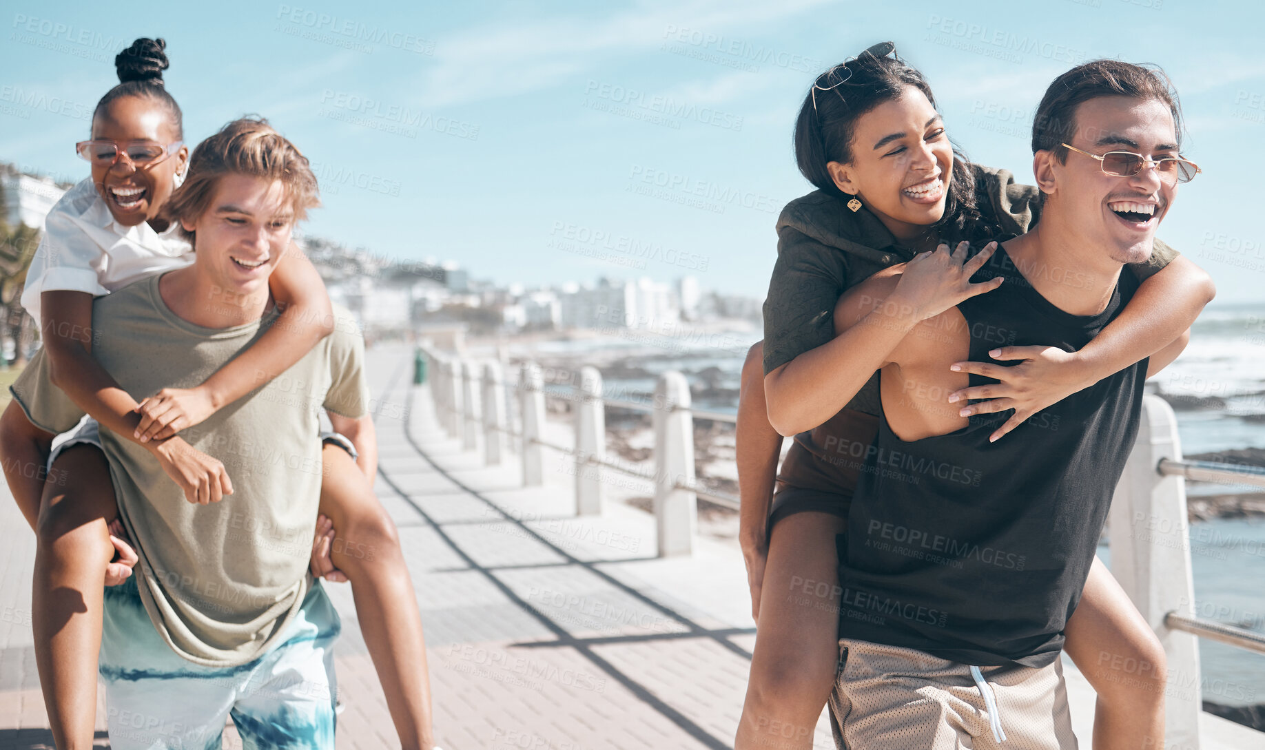 Buy stock photo Diversity men, laughing and piggyback by beach, ocean or sea in social gathering, group vacation comedy or summer holiday. Smile, happy and couple of friends carrying women in travel, bonding or game